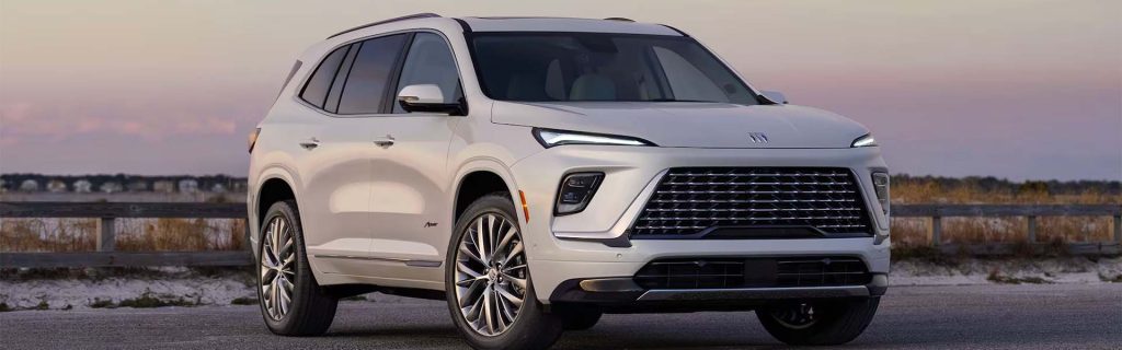 2025 Buick Enclave parked in front of a beach 