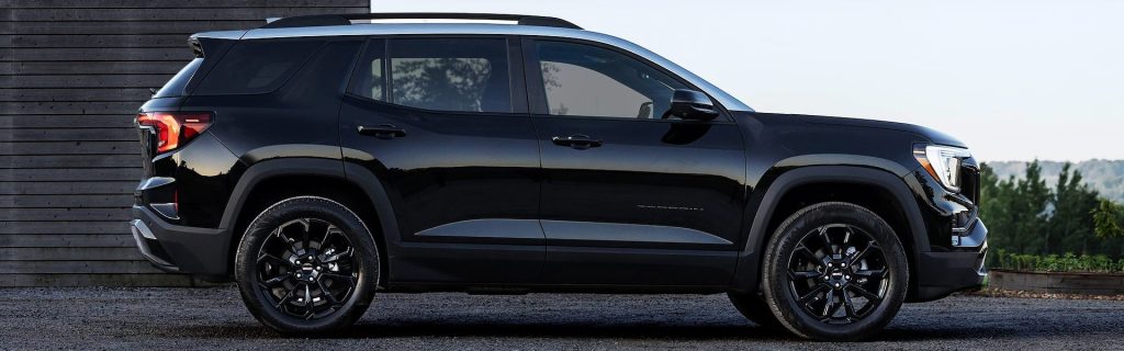 2025 GMC Terrain parked in front of a house