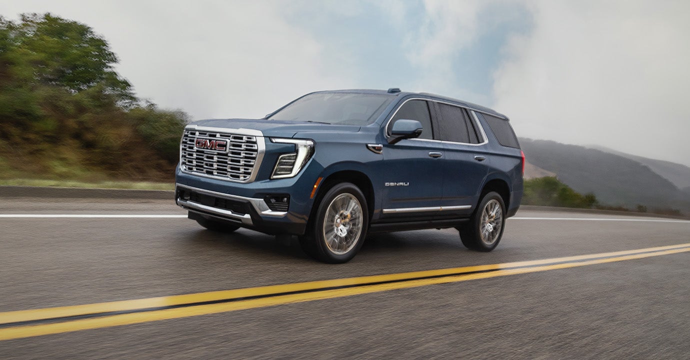 2026 GMC Yukon Denali, a compact SUV, showcasing its sleek design and premium features in a modern urban setting.